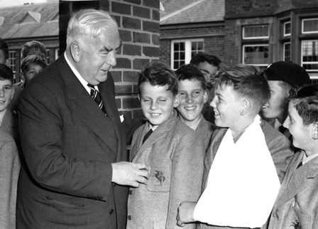 Prime Minister, Sir Robert Menzies with Preparatory School students <br/>at Geelong College after the opening of the Science Centre in 1964.